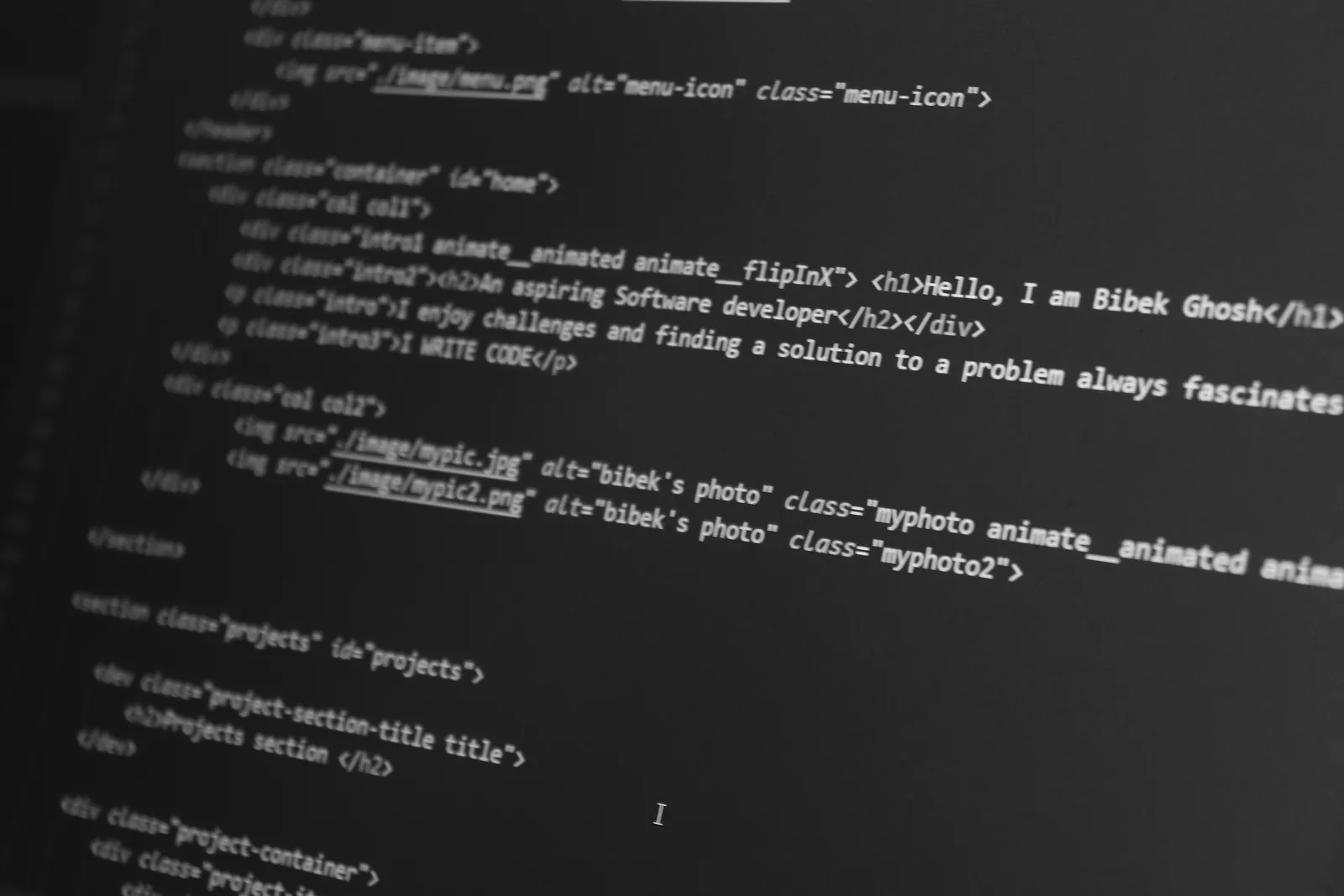 Lines of colored HTML code on a monitor