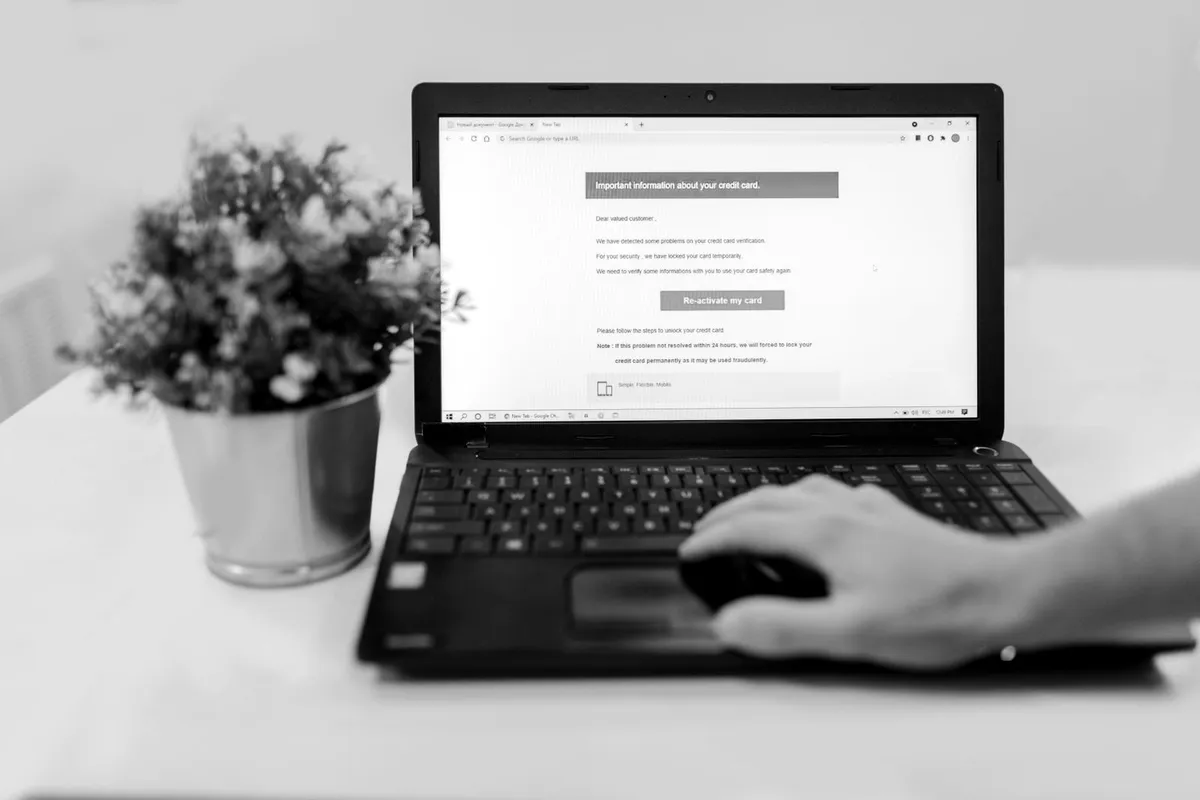 Person reading an email on a laptop