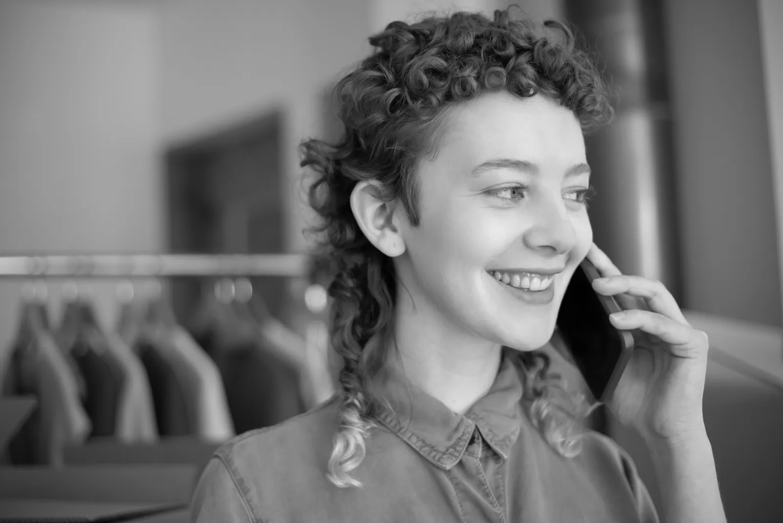 Woman smiling while on a phone call